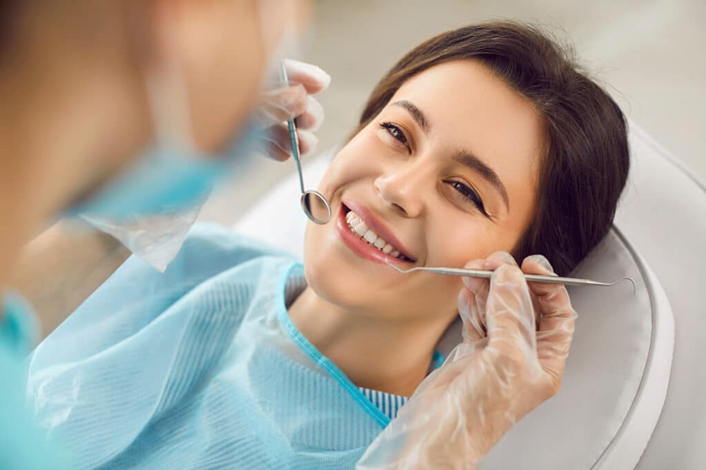 Woman having dental work done